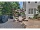 Outdoor patio with dining area, grill and manicured landscaping provides ample space for outdoor enjoyment at 4536 Rustling Woods Dr, Denver, NC 28037