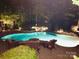 Inviting backyard pool with elegant lighting, creates a relaxing nighttime ambiance at 4536 Rustling Woods Dr, Denver, NC 28037