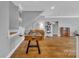 Hardwood floor recreation room features a foosball table, piano, and cat tree at 4536 Rustling Woods Dr, Denver, NC 28037