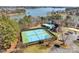 Aerial shot of community tennis courts, pool, and clubhouse with lake in background at 4536 Rustling Woods Dr, Denver, NC 28037