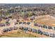 An aerial view shows a new construction neighborhood, nestled among trees at 456 Lucky Dr, Concord, NC 28027