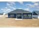 Back of house with patio and seating, showcasing the home's backyard at 456 Lucky Dr, Concord, NC 28027