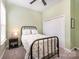 This bedroom has a black metal bed frame, floral bedding, and a closet at 456 Lucky Dr, Concord, NC 28027