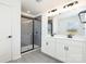 This bathroom features a double vanity and glass enclosed shower with gray tiling at 5013 Dunsford Dr, Denver, NC 28037