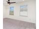 This bright bedroom has neutral carpet and natural light from two windows at 5013 Dunsford Dr, Denver, NC 28037