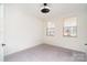 Bright bedroom with two windows, a ceiling fan, and carpeted floors at 5013 Dunsford Dr, Denver, NC 28037