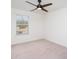 This bedroom has neutral carpet and a window at 5013 Dunsford Dr, Denver, NC 28037