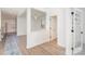 Bright entryway with wood floors, white trim, and an open-concept design at 5013 Dunsford Dr, Denver, NC 28037