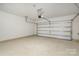 This two car garage has an insulated door and sealed flooring at 5013 Dunsford Dr, Denver, NC 28037