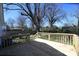 Newly constructed wooden deck and railing in a tree filled backyard at 621 Cauthen St, Rock Hill, SC 29730