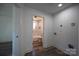 Laundry area adjacent to updated bathroom featuring a tiled shower and tub combination with white fixtures at 621 Cauthen St, Rock Hill, SC 29730