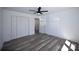 Bedroom features a ceiling fan, closet, and light-filled window at 621 Cauthen St, Rock Hill, SC 29730