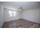 Neutral bedroom featuring a ceiling fan, window, and an exterior door at 621 Cauthen St, Rock Hill, SC 29730