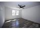 A bedroom featuring modern ceiling fan and view of the outside at 621 Cauthen St, Rock Hill, SC 29730