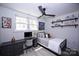 Comfortable bedroom with neutral paint, hardwood floors, modern lighting and plenty of natural light at 621 Cauthen St, Rock Hill, SC 29730