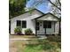 Charming home with white siding, black trim, and a cozy front porch at 621 Cauthen St, Rock Hill, SC 29730