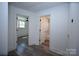 Hallway view showing entrances to a bedroom and a bathroom in a freshly renovated home at 621 Cauthen St, Rock Hill, SC 29730