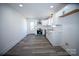Newly renovated kitchen with white cabinets, stainless steel appliances, subway tile backsplash, and modern flooring at 621 Cauthen St, Rock Hill, SC 29730