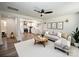 Bright living room featuring a modern ceiling fan, neutral color palette and an open floor plan to the kitchen at 621 Cauthen St, Rock Hill, SC 29730