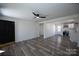 Open living room with an adjoining open kitchen, light walls and dark trim at 621 Cauthen St, Rock Hill, SC 29730