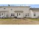 Backyard with a patio and a small patch of grass, featuring an off white vinyl siding home at 6635 Vlosi Dr, Charlotte, NC 28226