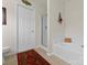 Well-lit bathroom with a soaking tub and glass shower, featuring modern fixtures at 6635 Vlosi Dr, Charlotte, NC 28226