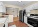 Well-equipped kitchen offering ample counter space, modern appliances, and a view into the adjacent dining area at 6635 Vlosi Dr, Charlotte, NC 28226