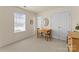 Inviting room features a wooden table and neutral walls with carpeting, adjacent to an ensuite at 6635 Vlosi Dr, Charlotte, NC 28226