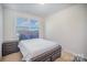 Cozy bedroom featuring a bed with storage drawers and natural light with view of the outside at 758 Waterscape Ct, Rock Hill, SC 29730