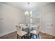 Bright dining area with a modern chandelier, complemented by a window and a built-in seating area at 758 Waterscape Ct, Rock Hill, SC 29730