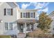 Charming two-story home featuring a welcoming front porch and a neatly maintained lawn at 758 Waterscape Ct, Rock Hill, SC 29730