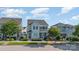 Charming two-story home featuring a light blue exterior, black shutters, and a well-manicured front yard at 758 Waterscape Ct, Rock Hill, SC 29730