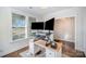 Well-lit home office space, featuring dual monitors on a standing desk and a window with a view at 758 Waterscape Ct, Rock Hill, SC 29730