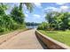 Beautiful walkway leading to the waterfront, featuring a bench for relaxing and enjoying the view at 758 Waterscape Ct, Rock Hill, SC 29730