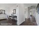 Hallway view featuring hardwood floors, a desk space, and neutral paint at 8051 Plymouth Dr, Sherrills Ford, NC 28673