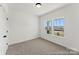 Comfortable bedroom with neutral carpet, white trim, and a view from a double window at 810 Gondola Ct # 136P, Salisbury, NC 28144