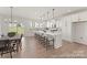 Bright eat-in kitchen features a large center island, stainless steel appliances and views into the backyard at 810 Gondola Ct # 136P, Salisbury, NC 28144