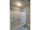 This hall bathroom is equipped with a shower and tub combination and bright lighting at 9130 Charminster Ct, Charlotte, NC 28269