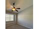 Bright bedroom featuring plush carpet, a ceiling fan and a window for natural light at 9130 Charminster Ct, Charlotte, NC 28269