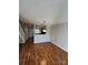 Inviting living room with sleek wood floors and staircase, creating a welcoming atmosphere at 9130 Charminster Ct, Charlotte, NC 28269