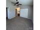 Spacious main bedroom with vaulted ceiling, plush carpet and ensuite bathroom at 9130 Charminster Ct, Charlotte, NC 28269