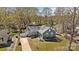 Aerial view showcasing the home's architecture, landscaped yard, and surrounding neighborhood at 9418 Stately Oak Ln, Mint Hill, NC 28227