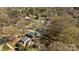 An aerial view of a quiet residential neighborhood with tree-lined streets, showcasing the homes and the surrounding environment at 9418 Stately Oak Ln, Mint Hill, NC 28227