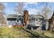 Home backyard featuring a deck and a chimney at 9418 Stately Oak Ln, Mint Hill, NC 28227