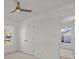 Bright bedroom featuring neutral walls, carpet flooring, two windows, a ceiling fan, and a closet at 9418 Stately Oak Ln, Mint Hill, NC 28227