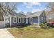 Charming single-story home with a gray exterior, well-maintained lawn, and inviting front entrance at 9418 Stately Oak Ln, Mint Hill, NC 28227