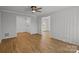 Spacious living room with wood floors and white trim offers a versatile living space at 9418 Stately Oak Ln, Mint Hill, NC 28227