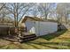 Exterior view of a shed with wooden steps in backyard at 9418 Stately Oak Ln, Mint Hill, NC 28227