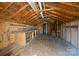 Interior of shed with wooden floor, shelving, and workspace at 9418 Stately Oak Ln, Mint Hill, NC 28227