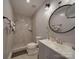 Modern bathroom with walk-in tiled shower, floating vanity, and stylish fixtures at 9786 Verdun Ct, Fort Mill, SC 29707